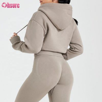 Anpassungsfähige Damen Zip-Up Hoodies Schlanke Passform Geschnittenes Fitnessstudio Tragen Sie atmungsaktive Strickgewebe für Frauen